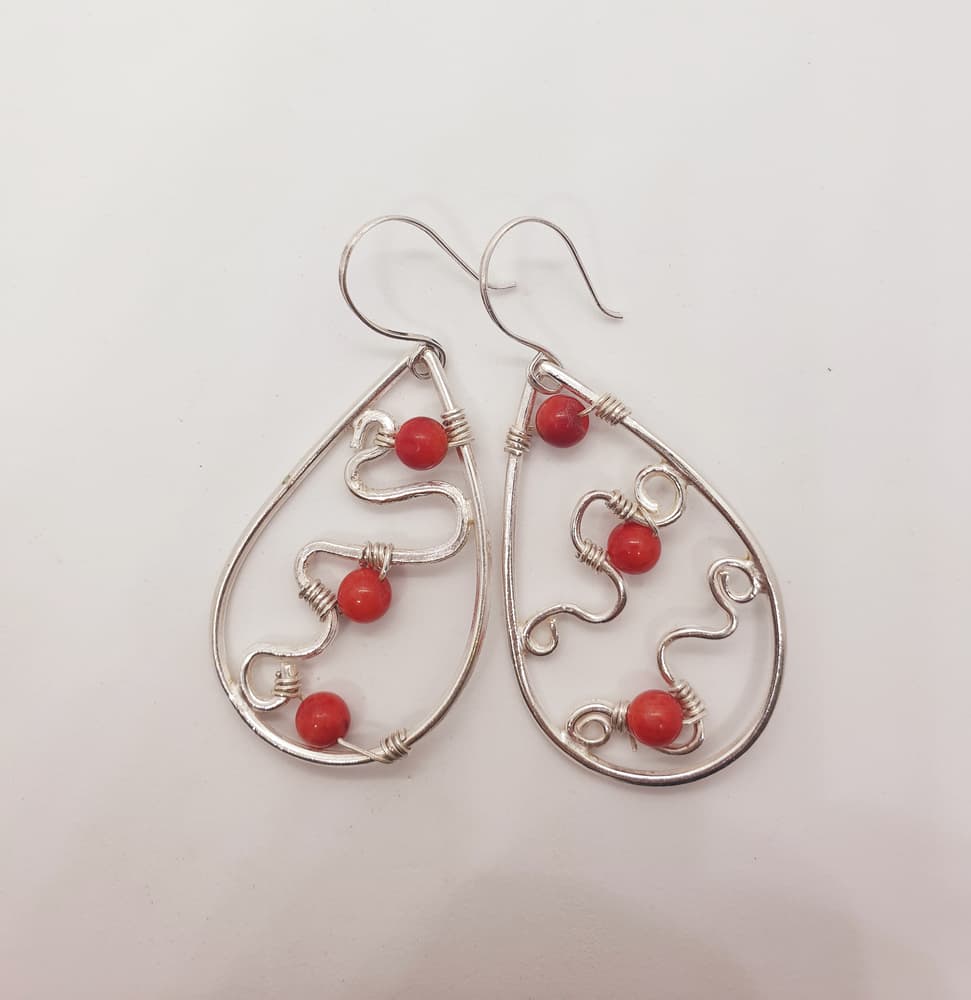 Teardrop shaped silver earring with red amber inside-2