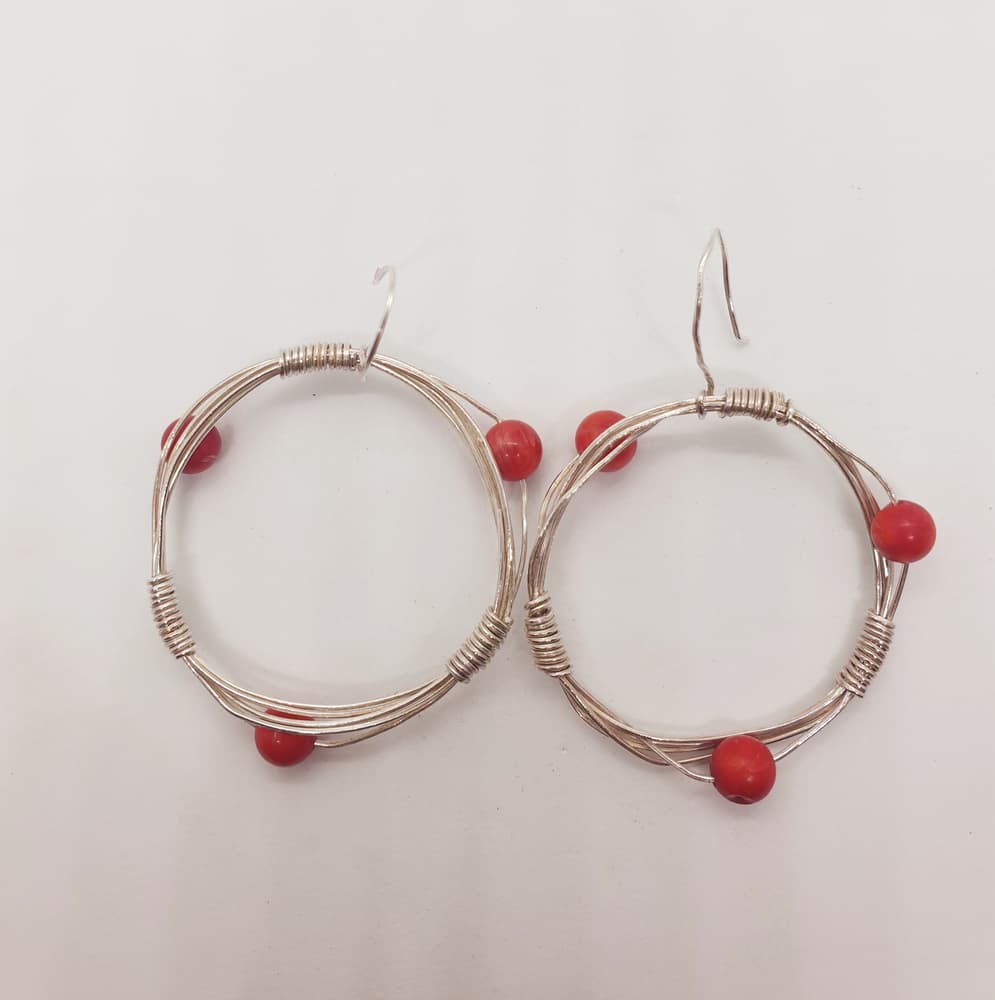 Circular thin silver wire with red amber