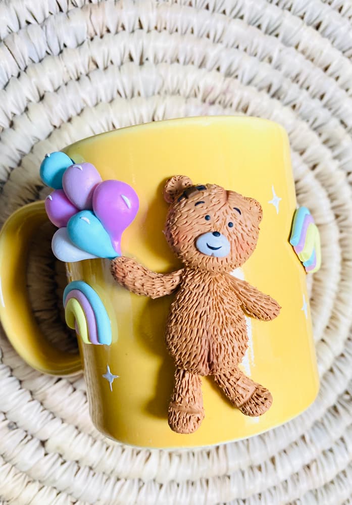 Cute Teedy bear holding ballons 